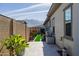 Landscaped backyard with a stone patio, artificial turf, and mountain views at 3538 E Hazeltine Way, Queen Creek, AZ 85142