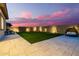 Landscaped backyard with a spacious patio and seating area at 3538 E Hazeltine Way, Queen Creek, AZ 85142