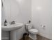 Clean bathroom with pedestal sink and updated fixtures at 3538 E Hazeltine Way, Queen Creek, AZ 85142