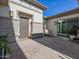 Inviting courtyard entry with brick accents and comfortable seating at 3538 E Hazeltine Way, Queen Creek, AZ 85142