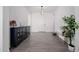 Bright and airy entryway with stylish console table and bench at 3538 E Hazeltine Way, Queen Creek, AZ 85142