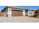 Home with a 2-car garage and a paved driveway, gated entry at 3538 E Hazeltine Way, Queen Creek, AZ 85142