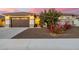 Beautiful home with a 2-car garage, landscaping, and a paved driveway at 3538 E Hazeltine Way, Queen Creek, AZ 85142