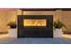 Modern outdoor fireplace perfect for cozy nights at 3538 E Hazeltine Way, Queen Creek, AZ 85142