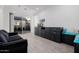 Gathering room with built-in cabinets, comfortable seating, and access to a patio at 3538 E Hazeltine Way, Queen Creek, AZ 85142