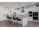 Gourmet kitchen boasts granite counters, stainless steel appliances and white cabinetry at 3538 E Hazeltine Way, Queen Creek, AZ 85142