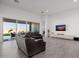 Relaxing living room with comfortable seating and sliding glass doors to backyard at 3538 E Hazeltine Way, Queen Creek, AZ 85142