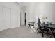 Home office with a desk, chair and large closet at 3538 E Hazeltine Way, Queen Creek, AZ 85142