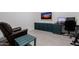 Home office with a comfortable chair and built-in cabinets at 3538 E Hazeltine Way, Queen Creek, AZ 85142
