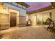 Private patio with wicker chairs and sliding glass doors at 3538 E Hazeltine Way, Queen Creek, AZ 85142