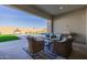Relaxing covered patio with outdoor furniture and view of pool at 3538 E Hazeltine Way, Queen Creek, AZ 85142