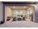 Relaxing covered patio with comfortable seating and views of the backyard at 3538 E Hazeltine Way, Queen Creek, AZ 85142