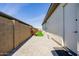 Landscaped side yard with artificial turf and brick pavers at 3538 E Hazeltine Way, Queen Creek, AZ 85142
