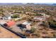 Aerial view of property showing house, outbuildings, and expansive desert landscape at 38406 N 12Th Ave, Phoenix, AZ 85086