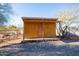 Wooden storage shed with covered porch at 38406 N 12Th Ave, Phoenix, AZ 85086