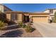 One-story home with desert landscaping and a two-car garage at 42282 W Lunar St, Maricopa, AZ 85138