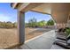 Covered patio, gravel yard, and desert landscaping at 4443 E Thorn Tree Dr, Cave Creek, AZ 85331
