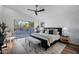 Main bedroom with hardwood floors, large windows, and access to backyard at 4443 E Thorn Tree Dr, Cave Creek, AZ 85331