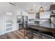 Modern kitchen with white cabinets, quartz countertops, and stainless steel appliances at 4443 E Thorn Tree Dr, Cave Creek, AZ 85331