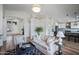 Open concept living room and kitchen with hardwood floors and modern decor at 4443 E Thorn Tree Dr, Cave Creek, AZ 85331