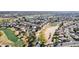 Aerial view of neighborhood adjacent to a golf course at 5450 E Mclellan Rd # 204, Mesa, AZ 85205