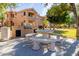 Outdoor kitchen area with built-in grill and stone table seating at 5450 E Mclellan Rd # 204, Mesa, AZ 85205