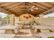 Relaxing covered patio with multiple tables and ceiling fans at 5450 E Mclellan Rd # 204, Mesa, AZ 85205