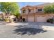 Two-story stucco home with attached two-car garage and landscaping at 5450 E Mclellan Rd # 204, Mesa, AZ 85205