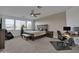 Bright bedroom featuring a comfortable bed and a convenient workspace at 556 W Weld St, San Tan Valley, AZ 85143
