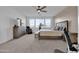 Spacious Primary bedroom with large windows and plenty of room for furniture at 556 W Weld St, San Tan Valley, AZ 85143
