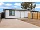 Backyard with concrete patio and wooden fence at 1014 S Price Rd, Tempe, AZ 85281