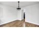 Bright dining room with hardwood floors and a modern light fixture at 1014 S Price Rd, Tempe, AZ 85281