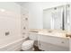 Clean bathroom with a bathtub, toilet and vanity at 10801 W Clair Dr, Sun City, AZ 85351