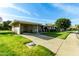 Ranch home with carport, driveway and lawn at 10801 W Clair Dr, Sun City, AZ 85351