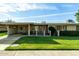 Brick ranch home with carport and landscaped lawn at 10801 W Clair Dr, Sun City, AZ 85351