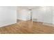Simple living room with wood-look floors at 10801 W Clair Dr, Sun City, AZ 85351