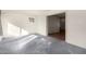 Living room with light-colored carpet and access to other rooms at 10801 W Clair Dr, Sun City, AZ 85351