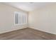 Bedroom featuring a large window with shutters at 11085 E Becker E Ln, Scottsdale, AZ 85259