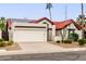 Single-story home with red tile roof, solar panels, and desert landscaping at 11085 E Becker E Ln, Scottsdale, AZ 85259