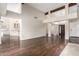 Living room with hardwood floors and views into kitchen area at 11085 E Becker E Ln, Scottsdale, AZ 85259