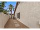 Landscaped side yard with stepping stones and AC unit at 11085 E Becker E Ln, Scottsdale, AZ 85259