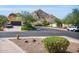 Home exterior view with mountain backdrop and two-car garage at 11229 N 23Rd Pl, Phoenix, AZ 85028