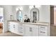 Modern bathroom with double vanity, marble countertops, and hexagon tile floors at 1237 E Mineral Rd, Gilbert, AZ 85234