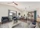 Virtually staged living room with ample natural light and seating at 14604 N 100Th Pl, Scottsdale, AZ 85260