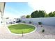 Artificial turf and hot tub in backyard oasis at 18157 W Foothill Dr, Surprise, AZ 85387