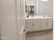 Bathroom with double vanity and shower at 18157 W Foothill Dr, Surprise, AZ 85387