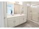 Bathroom with double vanity and shower at 18157 W Foothill Dr, Surprise, AZ 85387