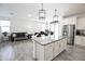 Kitchen with granite island and stainless steel appliances at 18157 W Foothill Dr, Surprise, AZ 85387