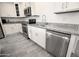 Stainless steel appliances and granite countertops in a modern kitchen at 18157 W Foothill Dr, Surprise, AZ 85387
