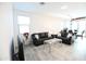 Living Room with two leather sofas and glass coffee table at 18157 W Foothill Dr, Surprise, AZ 85387